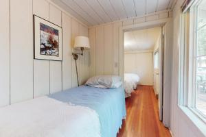 a bedroom with two beds and a window at Walk to Town! Dog-Friendly Quincy Getaway w/ Deck in Quincy