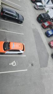 an aerial view of a parking lot with cars at City housing in Stavanger