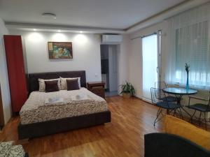 Posteľ alebo postele v izbe v ubytovaní Apartmani Pause
