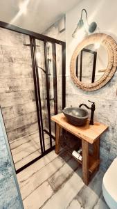 a bathroom with a sink and a mirror at Morze To Tu in Mielno +42 photos