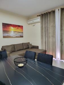 a living room with a table and a couch at Bella Vista Durazzo in Golem