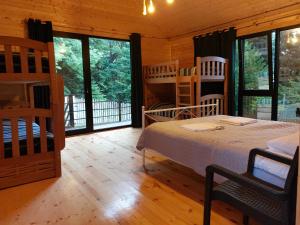 Postel nebo postele na pokoji v ubytování Cottage Mebirashi