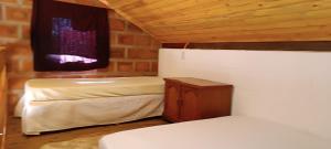 a small room with two beds and a window at Terras de Bragança in Bragança Paulista +36 photos