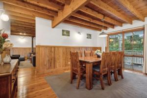 a dining room with a wooden table and chairs at Our Glenbogle in Medlow Bath