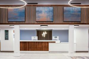 a lobby of a hospital with a waiting room at Holiday Inn Blytheville by IHG in Blytheville +29 photos