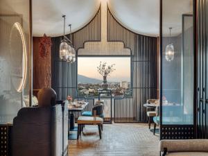a restaurant with a view of the city at InterContinental Chiang Mai The Mae Ping in Chiang Mai +166 photos