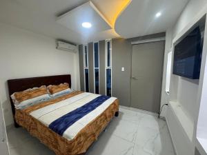 Postel nebo postele na pokoji v ubytování Hostal Las Orquideas 2