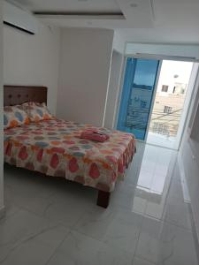 Postel nebo postele na pokoji v ubytování Hostal Las Orquideas 2
