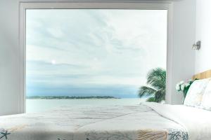 Postel nebo postele na pokoji v ubytování Hotel Caribbean Cartagena