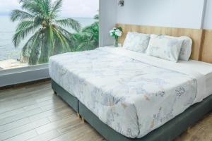 Postel nebo postele na pokoji v ubytování Hotel Caribbean Cartagena
