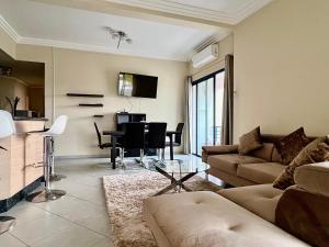 a living room with a couch and a table at Sweet Jacob's City Center in Agadir