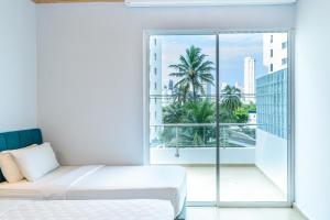 Postel nebo postele na pokoji v ubytování Hotel Caribbean Cartagena