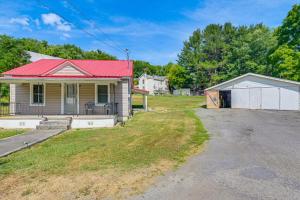 an old house with a red roof and a driveway at Cozy Tazewell Home with Grill on Back of the Dragon! in Tazewell