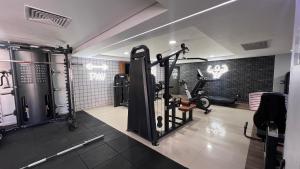 a gym with treadmills and ellipticals in a room at MARINAS PRAIA Flats in João Pessoa