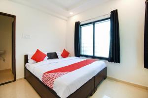 Ένα ή περισσότερα κρεβάτια σε δωμάτιο στο Super Collection O White House Regency