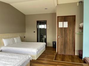 Letto o letti in una camera di Xin Yuan Hang Homestay