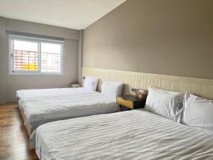 Letto o letti in una camera di Xin Yuan Hang Homestay