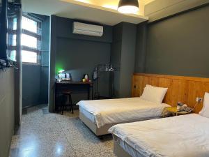 Letto o letti in una camera di Xin Yuan Hang Homestay