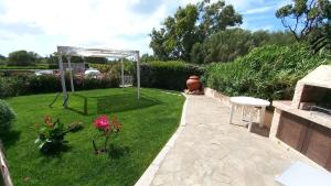 Κήπος έξω από το Sissi House - Trilocale con Giardino - Porto Pollo +22 φωτογραφίες