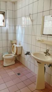a bathroom with a toilet and a sink at 在路上 in Lugang