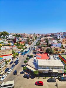 an aerial view of a city with cars parked at Appartement plus que parfait in Tangier
