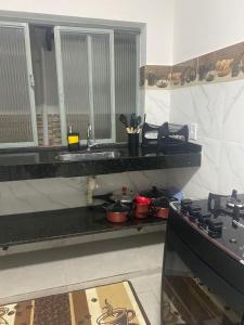 Kuchyň nebo kuchyňský kout v ubytování LM Home 2 - Casa com 3 Quartos + 6 fotografií