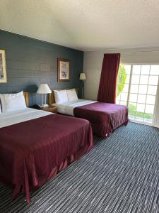Ένα ή περισσότερα κρεβάτια σε δωμάτιο στο Relax Inn Yreka