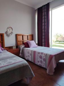 En eller flere senge i et værelse på Villa Santa Ana + 5 billeder