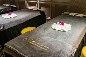 Voodi või voodid majutusasutuse Minerva Premium Hotel toas