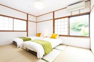 Voodi või voodid majutusasutuse Miraie Yokkaichi Aobacho toas