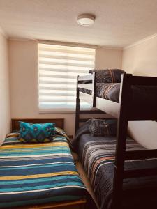 Postel nebo postele na pokoji v ubytování Departamento 2D2B con estacionamiento en pleno centro de Viña