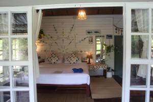 Katil atau katil-katil dalam bilik di Blue Lagoon Resort Koh Chang