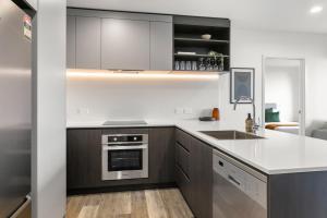 Kuchyň nebo kuchyňský kout v ubytování Urban Rest Sylvia Park Apartments