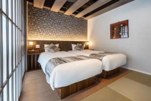 Letto o letti in una camera di 谷町君Hotel Crush On 京都四条烏丸