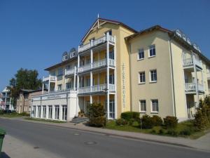 a large building on the side of a street at Flotsam and jetsam Modern retreat in Kühlungsborn