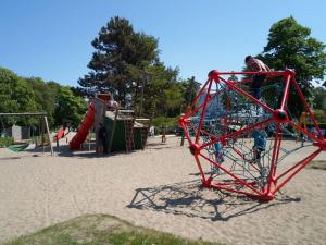 a group of children playing in a playground at Flotsam and jetsam Modern retreat in Kühlungsborn +13 photos