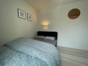 Postel nebo postele na pokoji v ubytování ティエラ北池袋