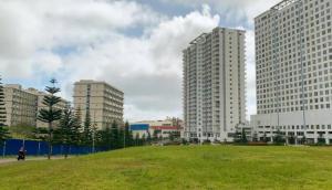 a city with tall buildings and a green field at Cagayan De Oro house in Cagayan de Oro