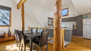 a kitchen and dining room with a table and chairs at Secret Hut in Dinner Plain