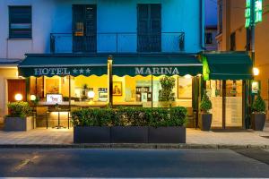 a store with a sign for a martini on a street at Marina B&B Adults Only in Sestri Levante