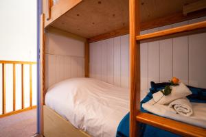 Un pat sau paturi într-o cameră la Chamonix Sud - Balme 401 - Happy Rentals