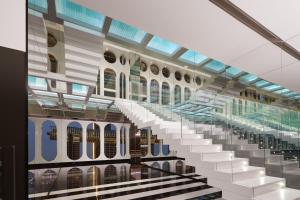 a staircase in a building with glass ceilings at ISEYA Panoramic Hotel Chongqing Jiefangbei Raffles Plaza in Chongqing