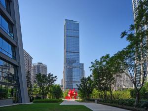 a view of a tall building in a city at ISEYA Panoramic Hotel Chongqing Jiefangbei Raffles Plaza in Chongqing