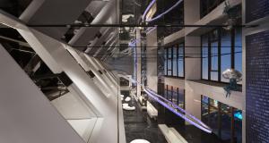 a view of the escalator in a building at ISEYA Panoramic Hotel Chongqing Jiefangbei Raffles Plaza in Chongqing