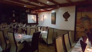 a restaurant with a table and chairs in a room at Locomotion in Eaglescliffe