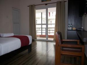 Uma cama ou camas num quarto em Hotel Nevis