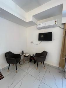 Televisyen dan/atau pusat hiburan di Avanthi Homestay