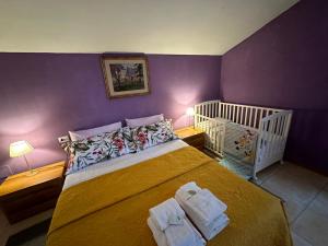 Postel nebo postele na pokoji v ubytování Casa vacanze Giuliani via Rasiglia