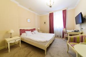 Postel nebo postele na pokoji v ubytování Ambasadorski Residence