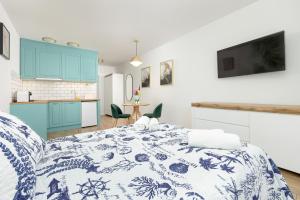 Kuchyň nebo kuchyňský kout v ubytování Akwamaryn Apartamenty